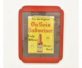Framed and matted metal advert