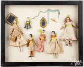 FRAMED GROUP OF SMALL DOLLS AN