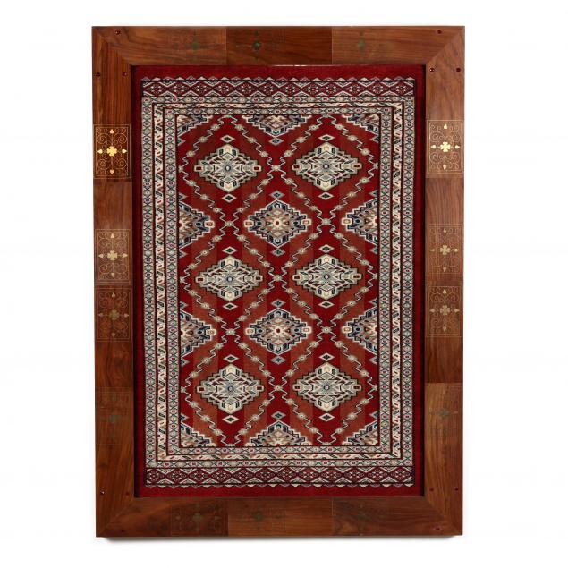 FRAMED ORIENTAL RUG Likely a