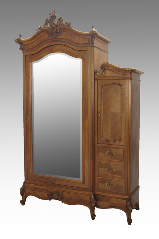 FRENCH WALNUT ARMOIRE: Carved crest