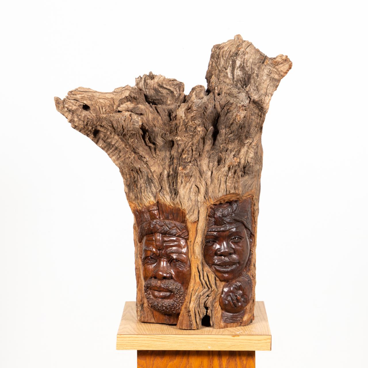 G. REZA CARVED DRIFT WOOD FAMILY