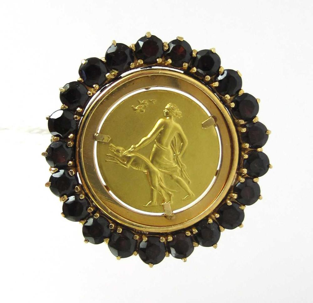GARNET AND EIGHTEEN KARAT GOLD