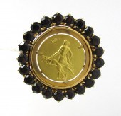 GARNET AND EIGHTEEN KARAT GOLD