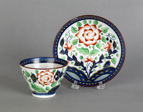 Gaudy Dutch primrose cup and saucer