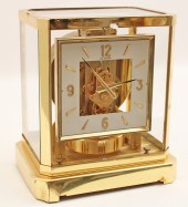 GILT BRASS AND GLASS CASE LECO