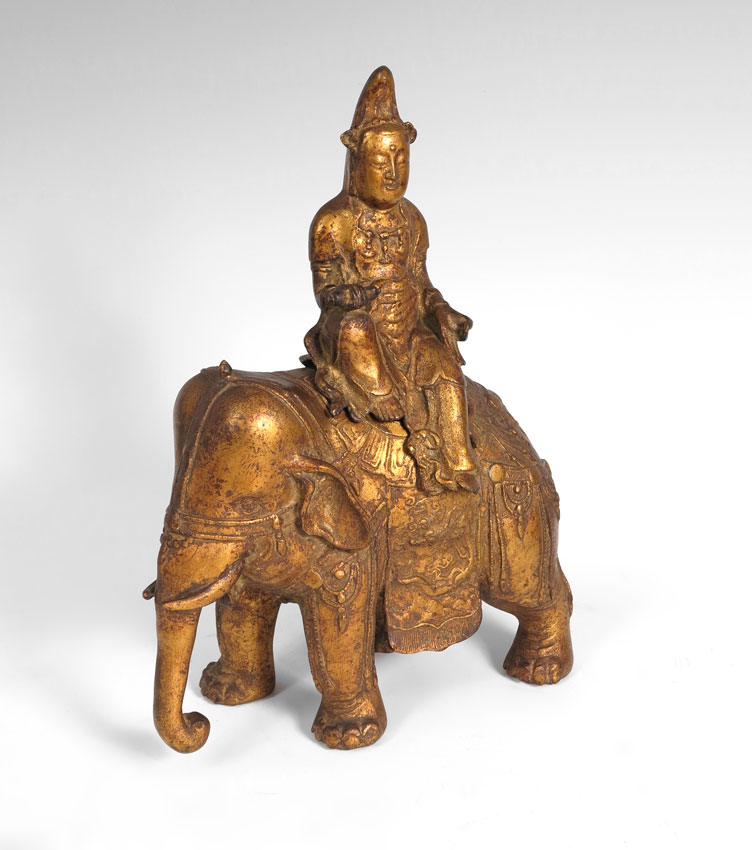GILT BRASS DEITY RIDING AN