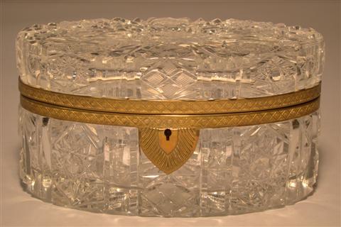 GILT-BRONZE MOUNTED OVAL GLASS