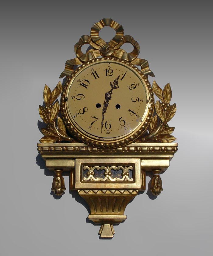 GILT WOOD CARTEL CLOCK: Gilt wood
