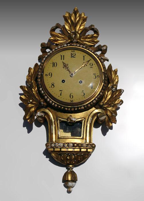 GILT WOOD CARTEL CLOCK: Gilt wood