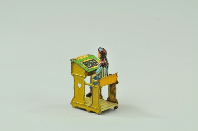 GIRL AT SCHOOL DESK PENNY TOY Meier