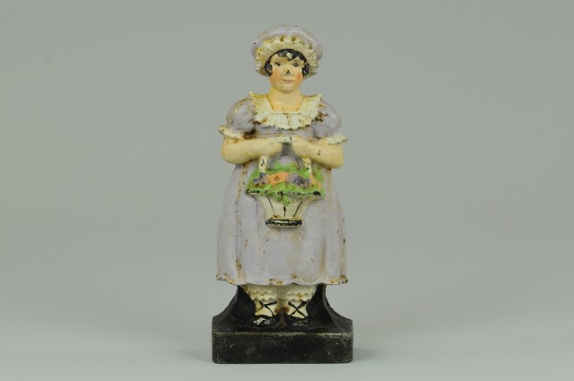 GIRL HOLDING FLOWER BASKET DOORSTOP