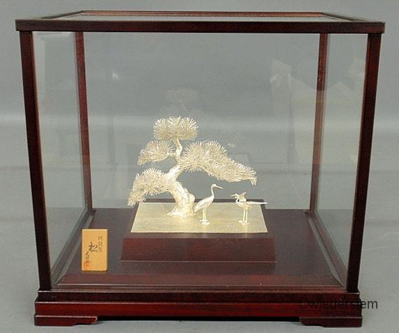 Glass cased Chinese silver