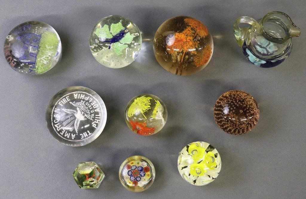 Glass paper weights including