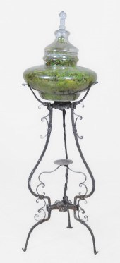 Glass terrarium on scrolled me