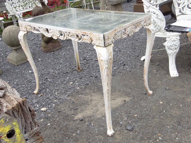 Glass top patio table. Top 23'' x