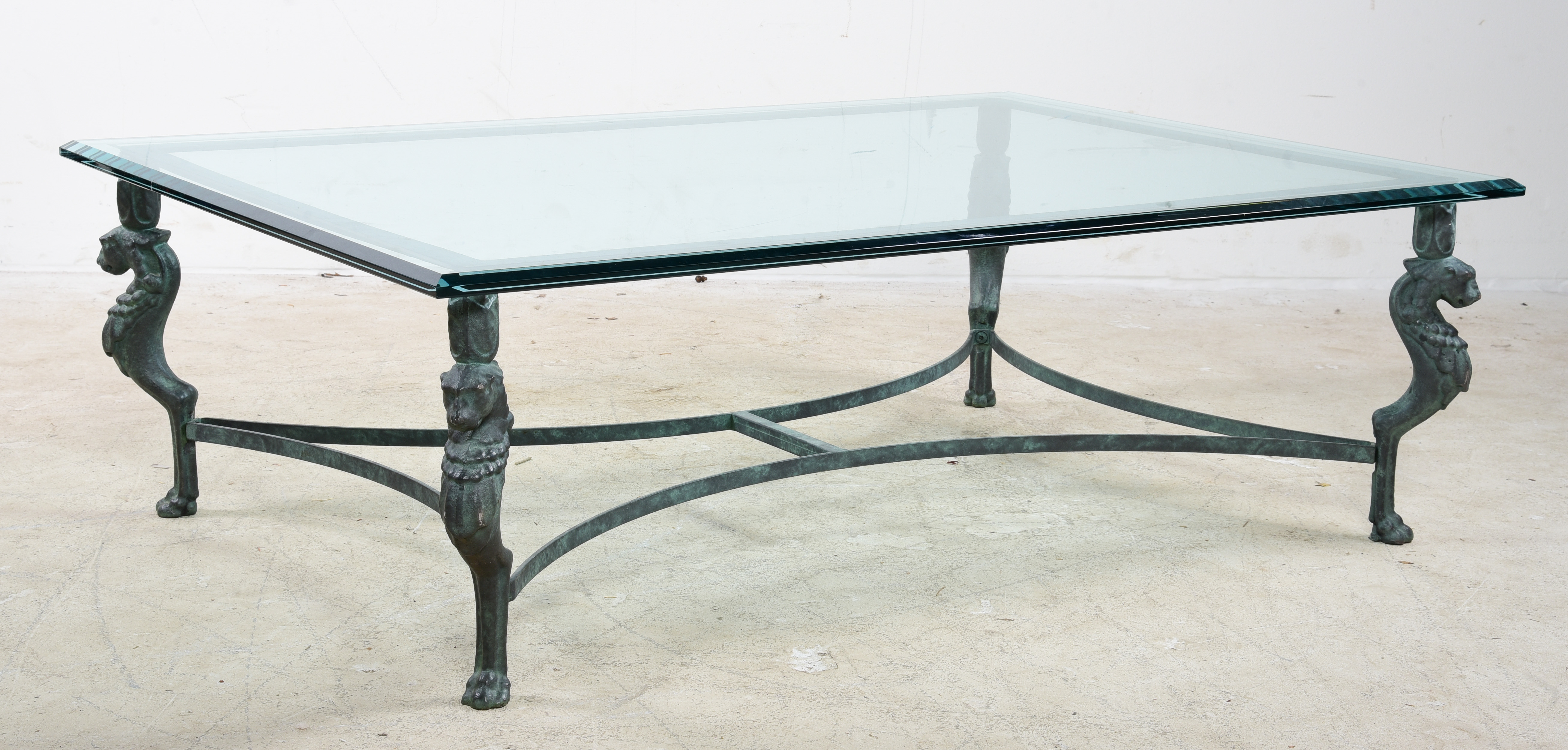 Glasstop coffee table on bronze