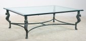 Glasstop coffee table on bronz