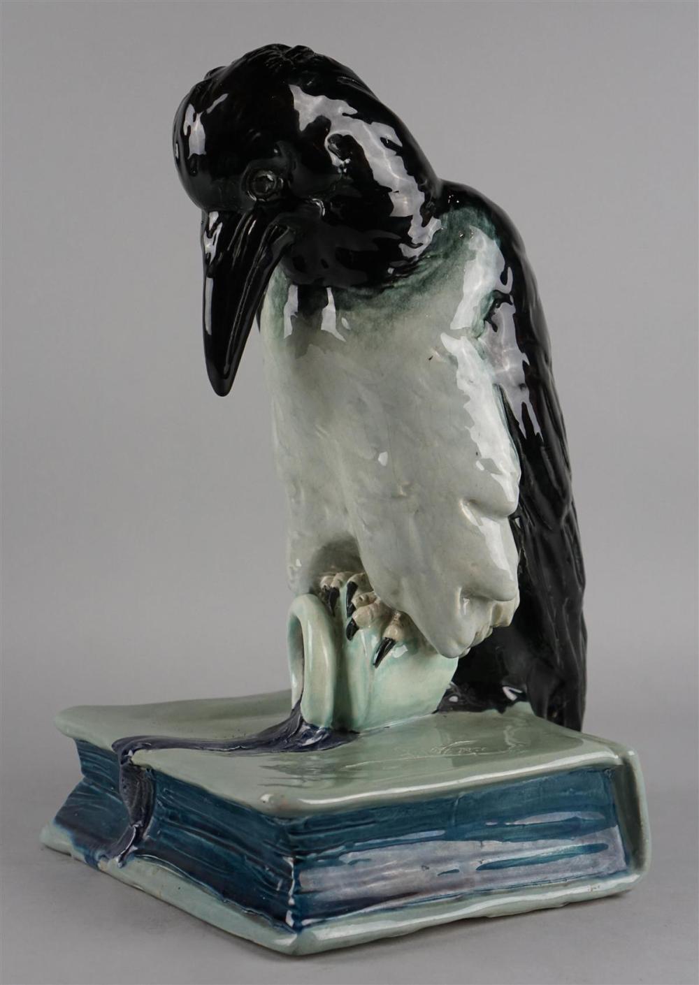 GLAZED POTTERY MODEL OF A RAVEN,