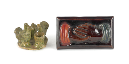 Glazed redware plaque of clasped