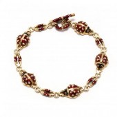 GOLD AND ENAMEL LADYBUG BRACEL