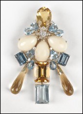 GOLD AND GEM SET BROOCH. Compr