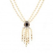 GOLD AND GEM-SET DOUBLE STRAND