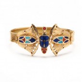 GOLD AND GEM-SET EGYPTIAN REVI
