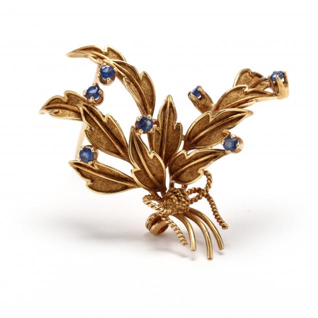GOLD AND GEM-SET FOLIATE MOTIF