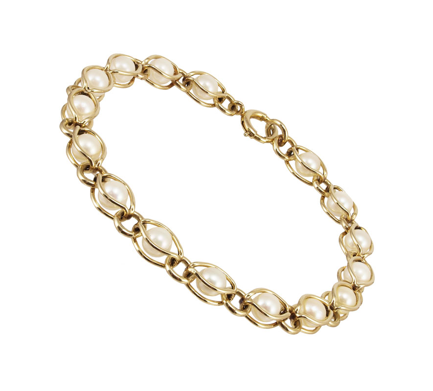 GOLD AND PEARL BRACELET: 14K yellow