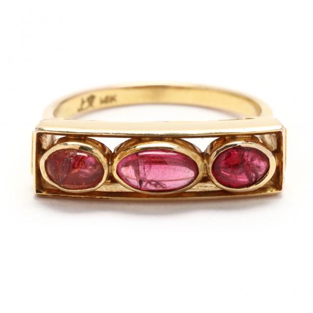 GOLD AND RUBY RING In a saddle