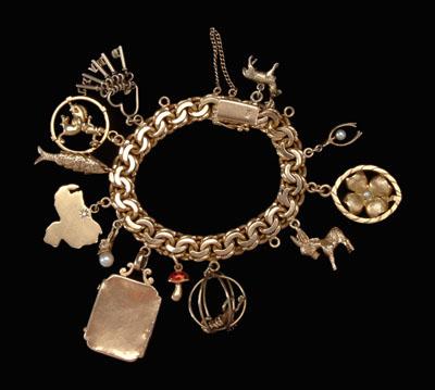 Gold charm bracelet, 18 kt.