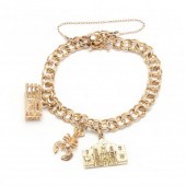 GOLD CHARM BRACELET The gold c