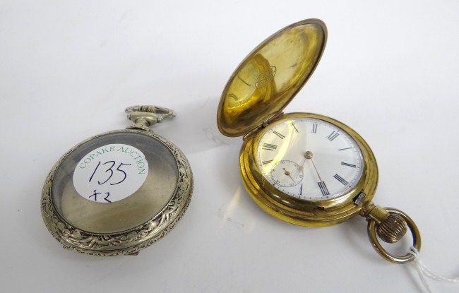 Gold colored pocket watch and