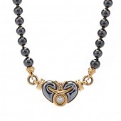 GOLD, HEMATITE, AND DIAMOND NE