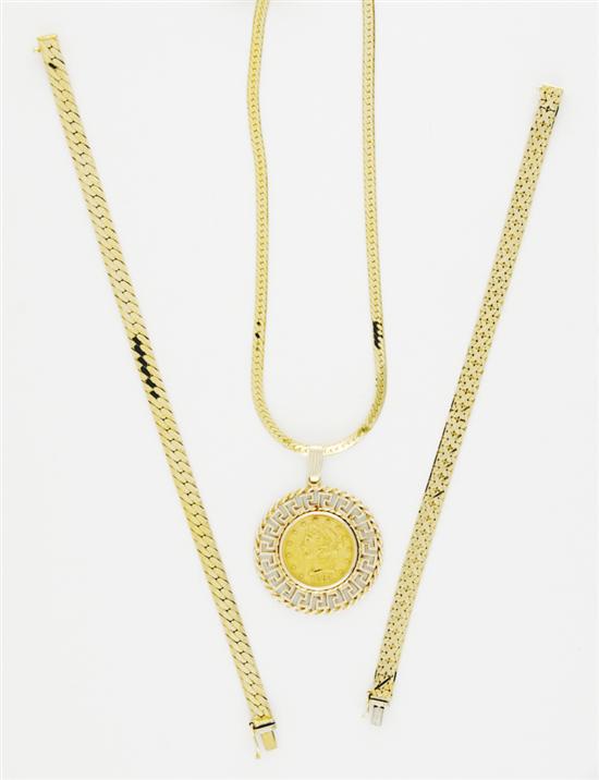 Gold necklace with coin pendant and