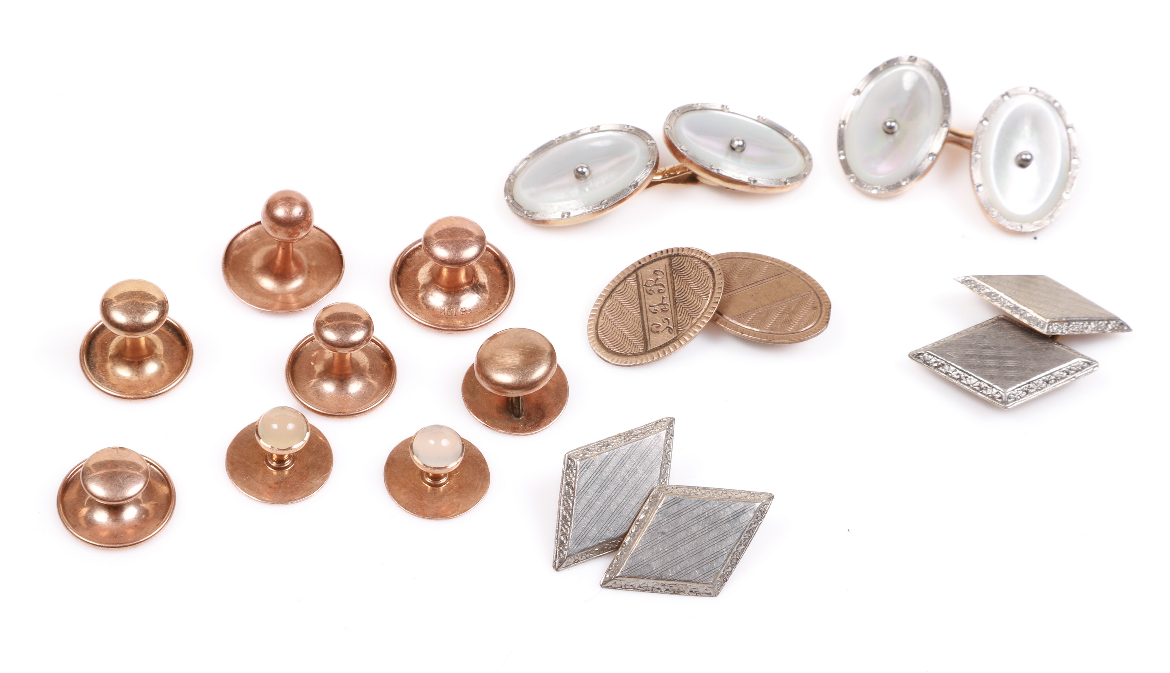 Gold stud buttons and cufflinks