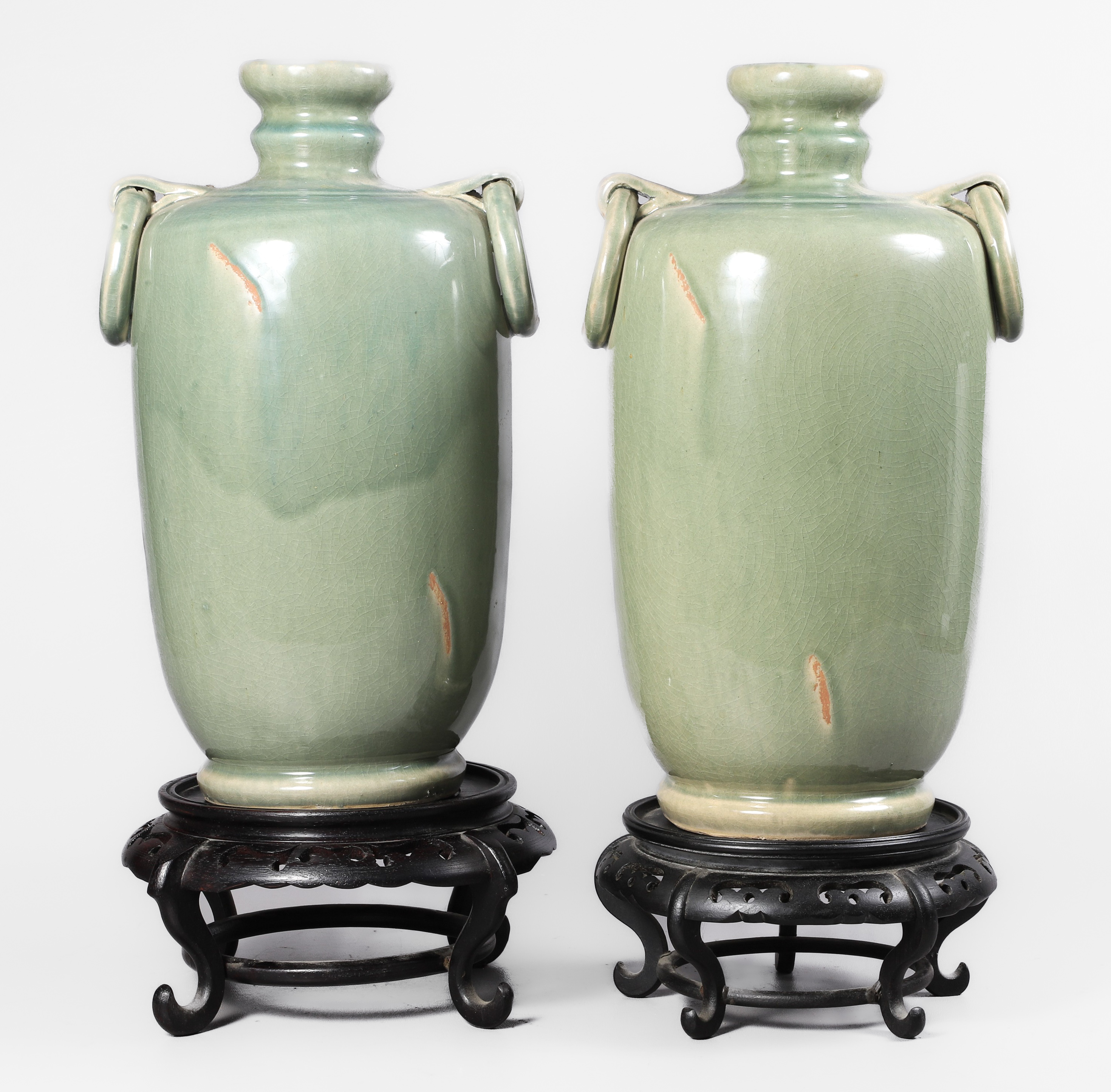 Green glazed pottery vase pair on