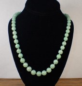 GREEN JADE AND FOURTEEN KARAT