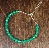 GREEN JADE AND FOURTEEN KARAT