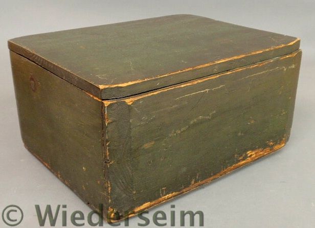 Green painted storage box with news