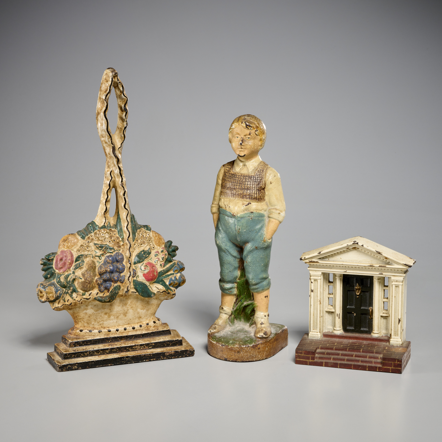 GROUP (3) CAST IRON DOORSTOPS