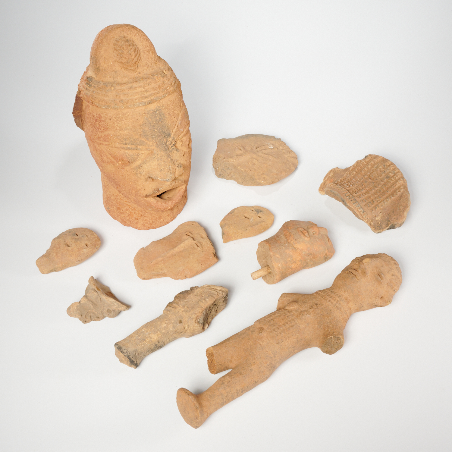 GROUP AFRICAN TERRA COTTA HEADS AND