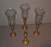 GROUP FOUR BRASS WEIGHTED CAND