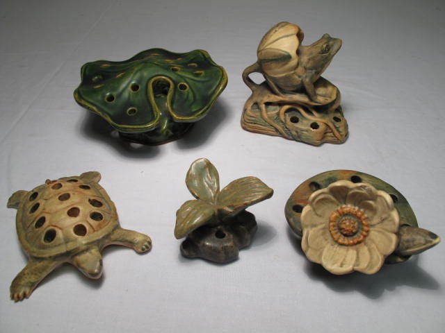 Group lot of assorted flower frogs.
