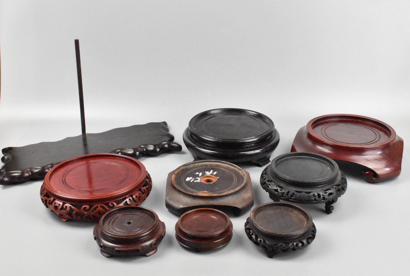 GROUP OF 10 CHINESE WOODEN STANDS A