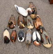 GROUP OF 12 CARVED DECOYS TO I