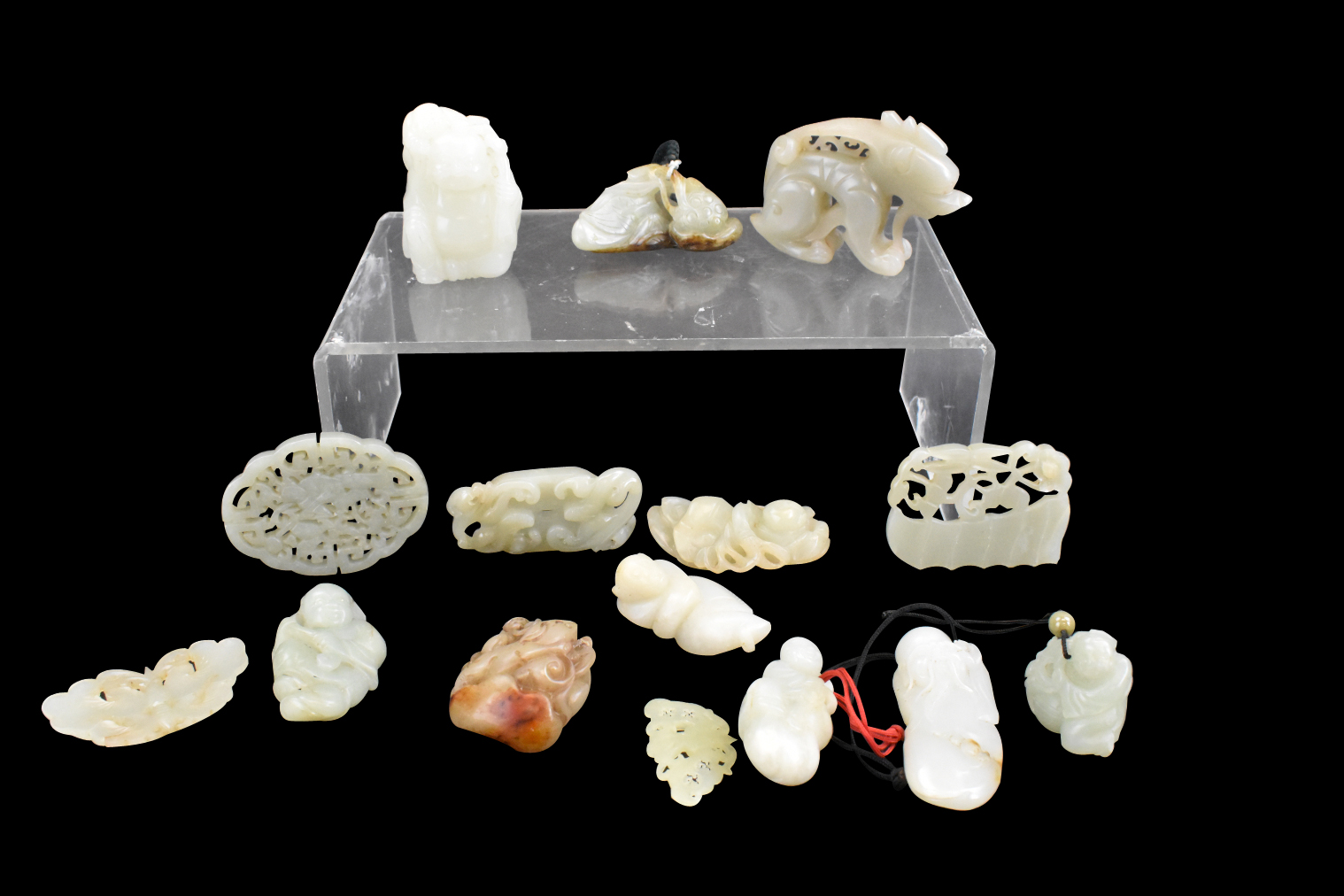 GROUP OF 15 JADE CARVED TOGGLE,