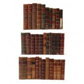 GROUP OF 32 ANTIQUE LEATHERBOU