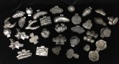 GROUP OF 34 PEWTER CHOCOLATE A