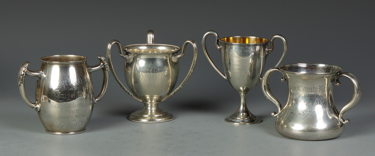 Group of 4 Sterling Trophies 128.